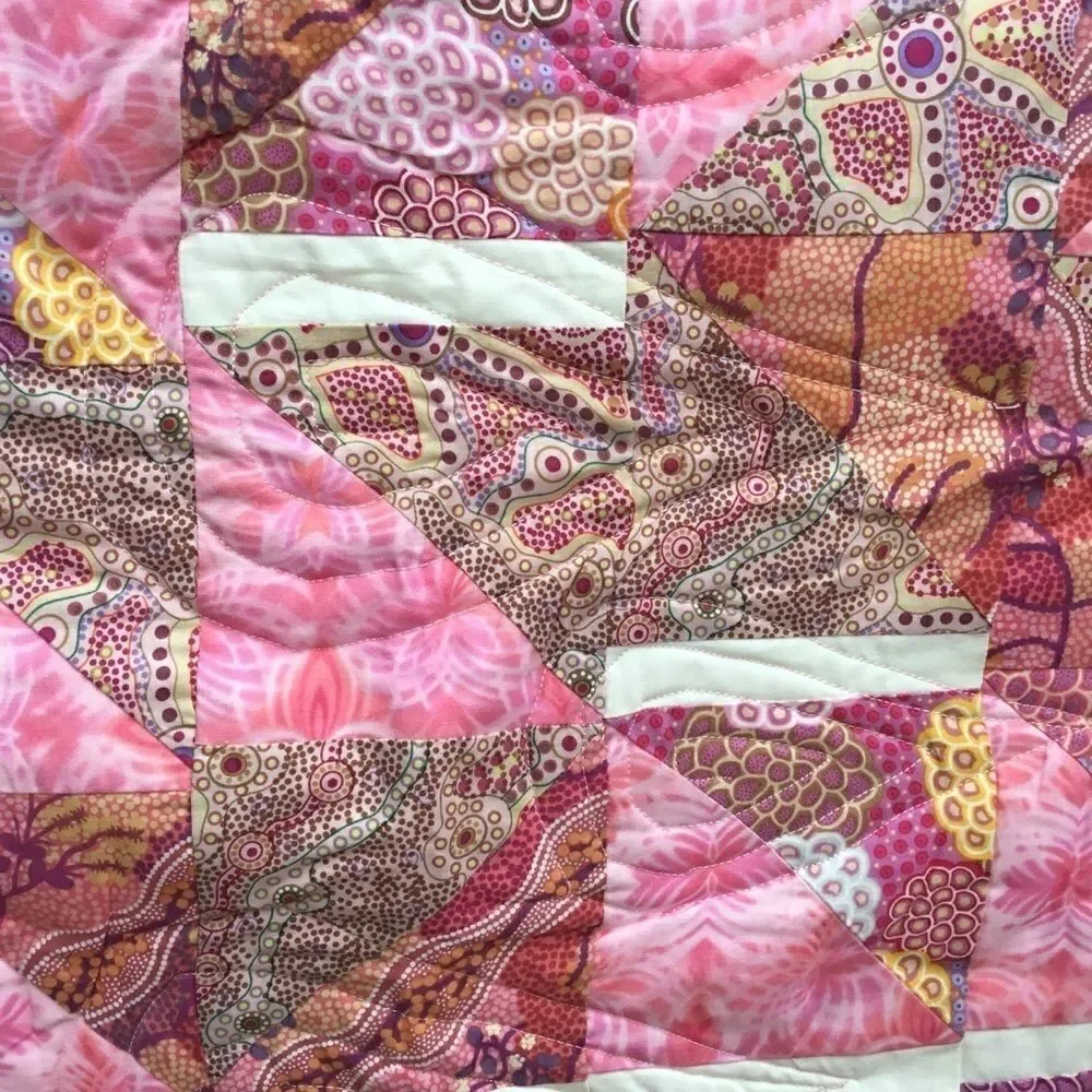 NWT. Hand Crafted Pinks Aboriginal Prints Quilt